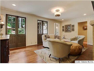 Cozy keeping room with fireplace and french doors 