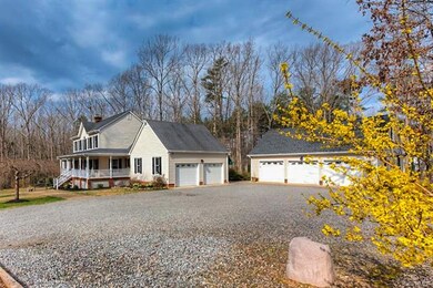 There is an attached 2-car garage and a detached 3-car garage with a second level of storage.