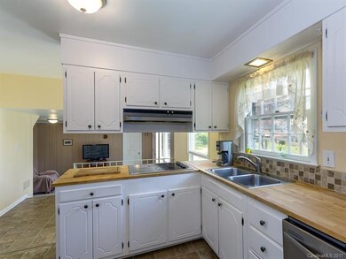 neutral kitchen is conveniently open to the family