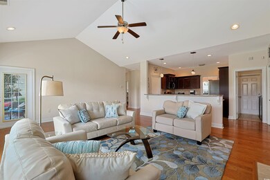 Living room with a wealth of natural light, lofted