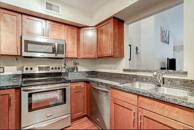 Kitchen with stainless steel appliances and granit