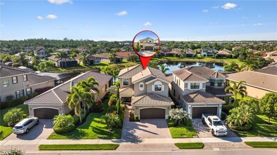 Drone / aerial view with a residential view and a water view