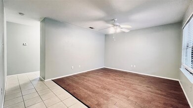 Unfurnished room with baseboards, a ceiling fan, 