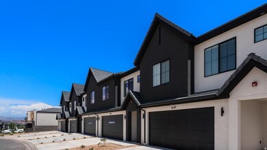 View of side of home with stucco siding, a residential view, and a garage