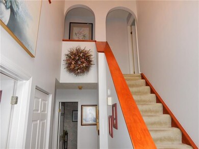 Beautiful 2 story entryway with the living room of