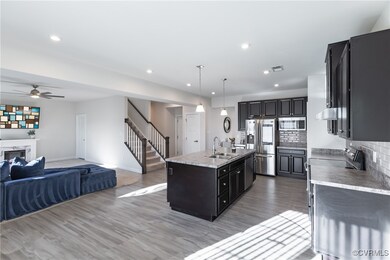 Kitchen featuring backsplash, a center island with