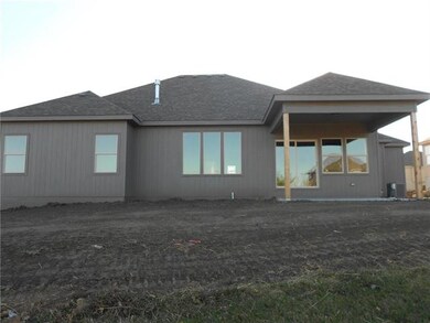 Back of home w/ lots of windows.