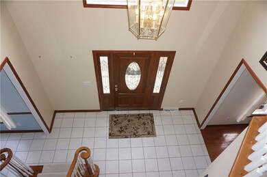 Two-Story Foyer with palladium window.