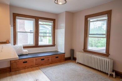Interior space featuring radiator and light hardwo