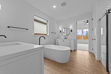 Primary bath with dual freestanding vanities
