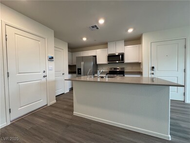 Kitchen with a sink, appliances with stainless ste