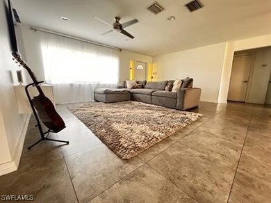 Living room featuring ceiling fan