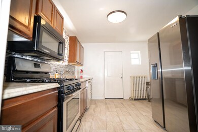 76 S Kossuth St, Baltimore, MD 21229 - photo 6