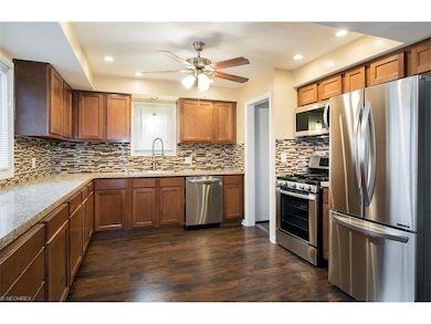 Custom backsplash and designer faucet