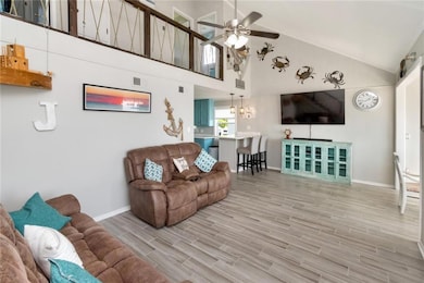 Living area with visible vents, baseboards, ceilin