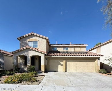 Mediterranean / spanish-style home featuring solar panels, driveway, stucco siding, and a tiled roof