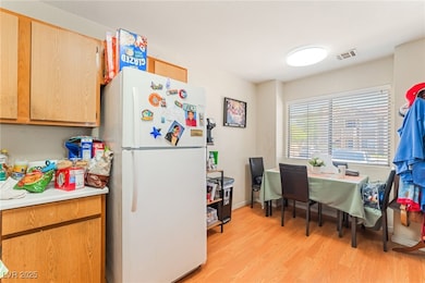 Unit A Kitchen with freestanding refrigerator, lig