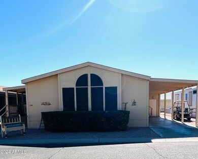 Front with storage and carport