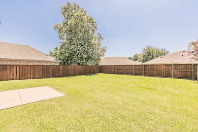 View of fenced backyard