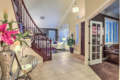 Two story foyer, double door entrance into main le