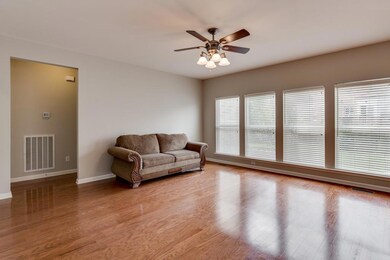 Nice great room with a wall of windows!  Whole home has been repainted Agreeable Grey!