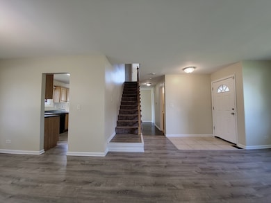 Central stair hall that connects the main level wi