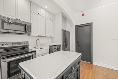 The additional island is convenient for extra counter space and storage.