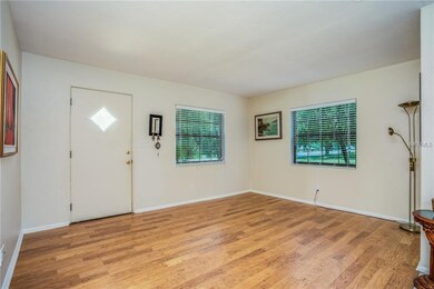 Front entry into living room with laminate floorin