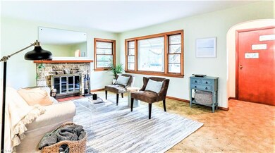 *LIVING ROOM WITH PICTURE WINDOW, STONE FIREPLACE 