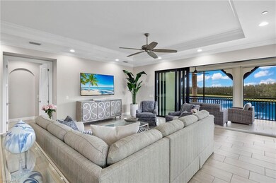 Great Room featuring a tray ceiling, crown molding