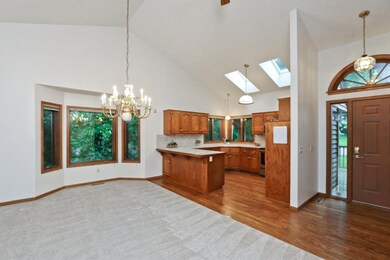 Refinished hardwood flooring in kitchen, entry and