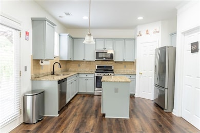 Kitchen with appliances with stainless steel finis