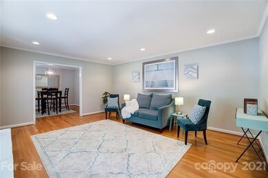 This spacious living room has original white oak f