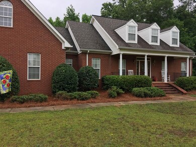 Front view with 3 dormers