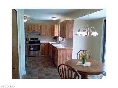 Another view of the full kitchen and dining area.