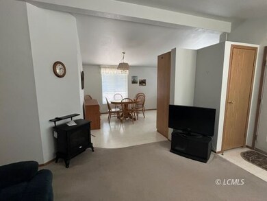 Living room looking into dining, kitchen