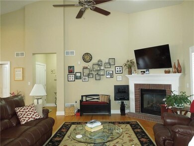 Family Room hosts vaulted ceilings, hardwood floor