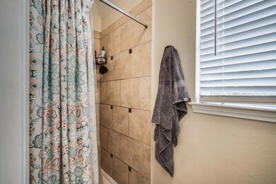 Bathroom with a shower with curtain