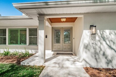 Front entry with mahogany ceiling and double door 
