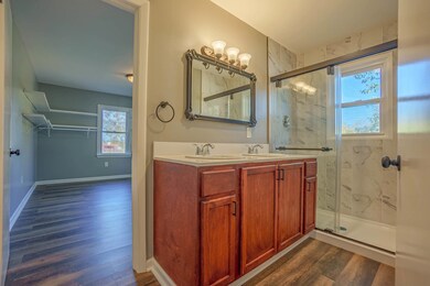 Bathroom with vanity, a healthy amount of sunlight