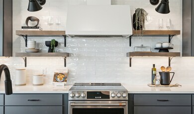 Kitchen with full-height tile backsplash