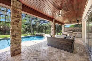 View of swimming pool with ceiling fan, area for g