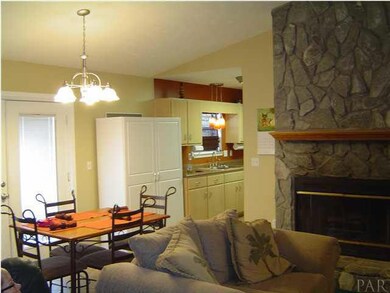 Stone faced wood burning fireplace & Dining area