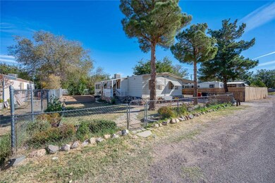 Manufactured / mobile home featuring a gate and a fenced front yard