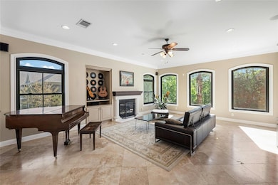Living room featuring crown molding, baseboards, 