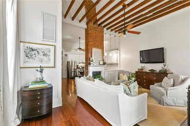 High ceilings, tons of natural light, hardwood flo