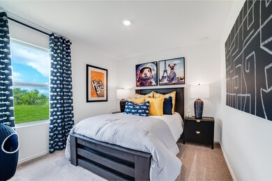 Carpeted bedroom with baseboards