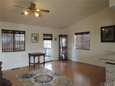 Open floor concept with laminate floors and vaulte