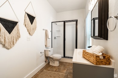 Bathroom featuring a stall shower and vanity
