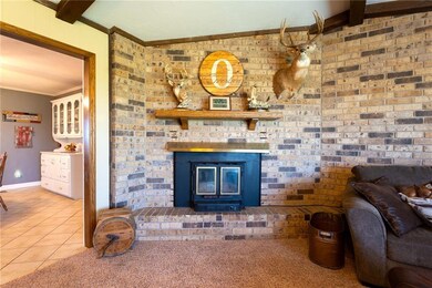 Living room with wood burning fireplace.